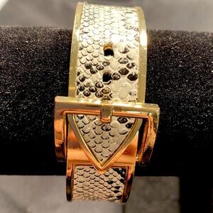 Belt Style Faux Snakeskin Bracelet. Adjustable Belt Buckle Closure.
